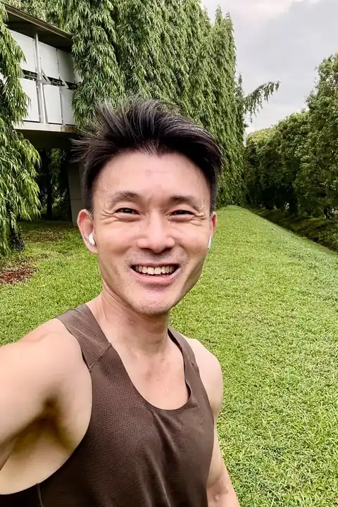 The one photo a guest takes at the booth: a smiling man in a vest, outdoors