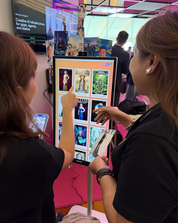 Two guests pick a portrait style on the booth's screen